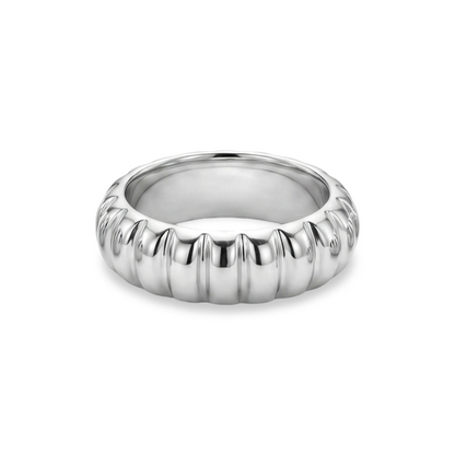 white gold ring with a ribbed design on a white background