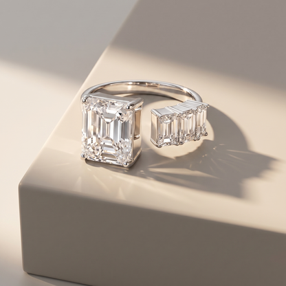 Diamond open ring with emerald cut diamonds shown on a neutral background