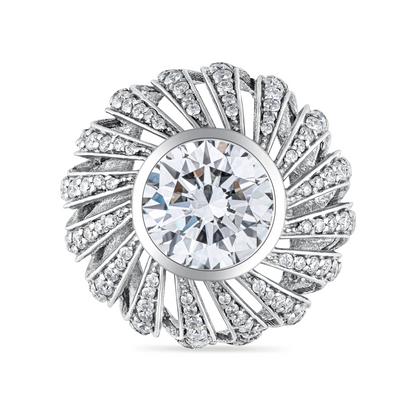 White gold large sculptural statement ring with a large central diamond and smaller stones in a wheel tourbillon vintage inspired design on a white background
