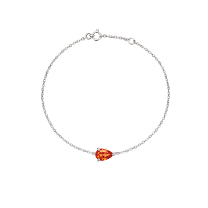 White gold bracelet with a pear cut orange sapphire, on a white background