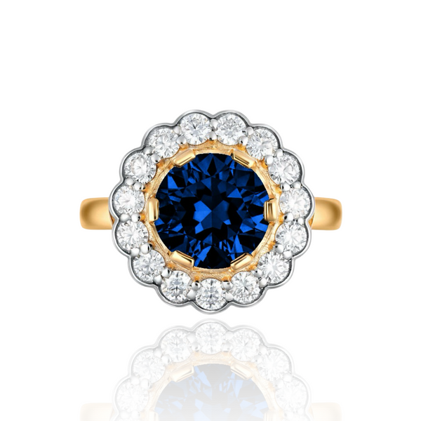 Gold daisy design vintage inspired ring with a blue sapphire and diamond-studded halo on a white background