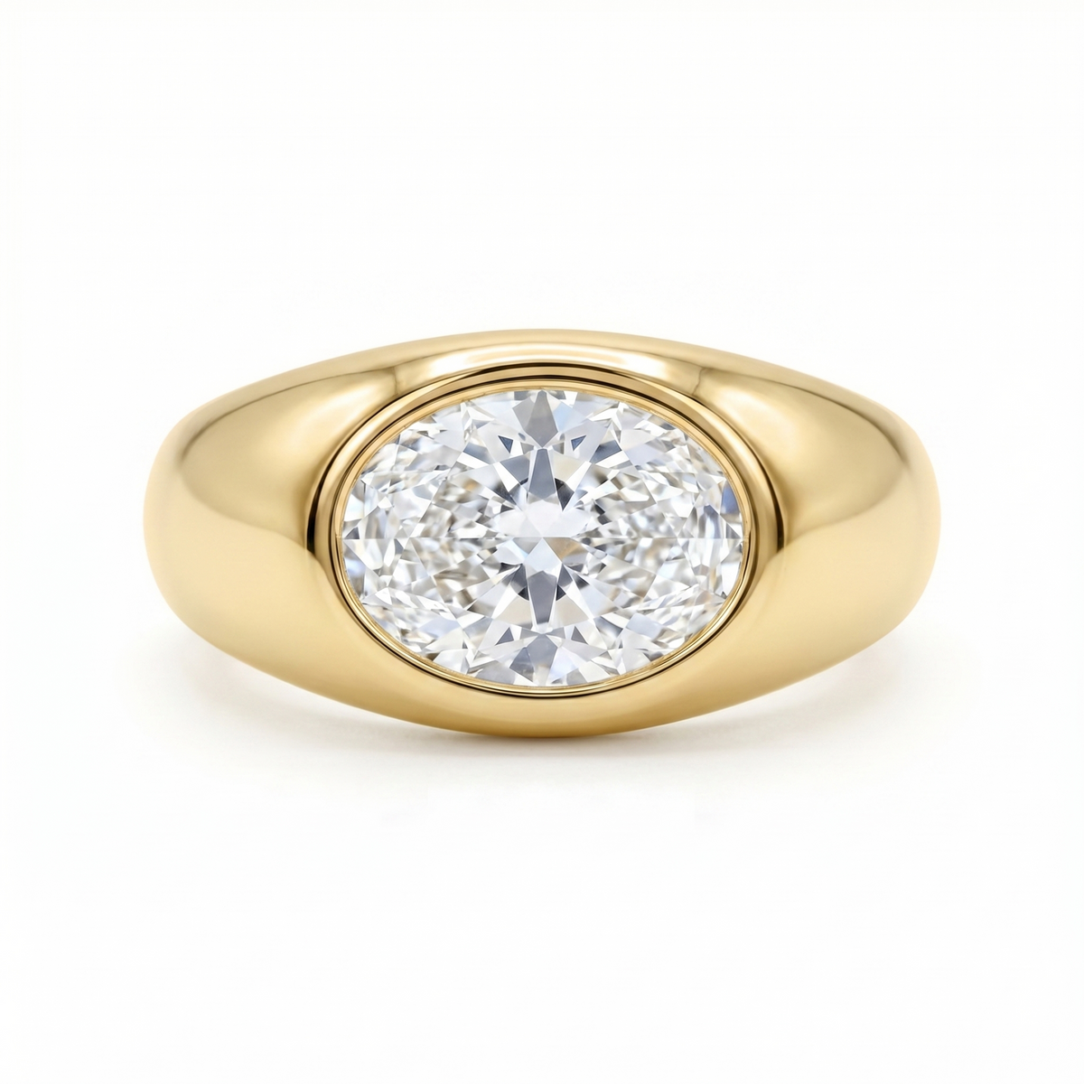 Gold signet ring with a large oval diamond laterally set; cutout product photo on a white background, full frontal view