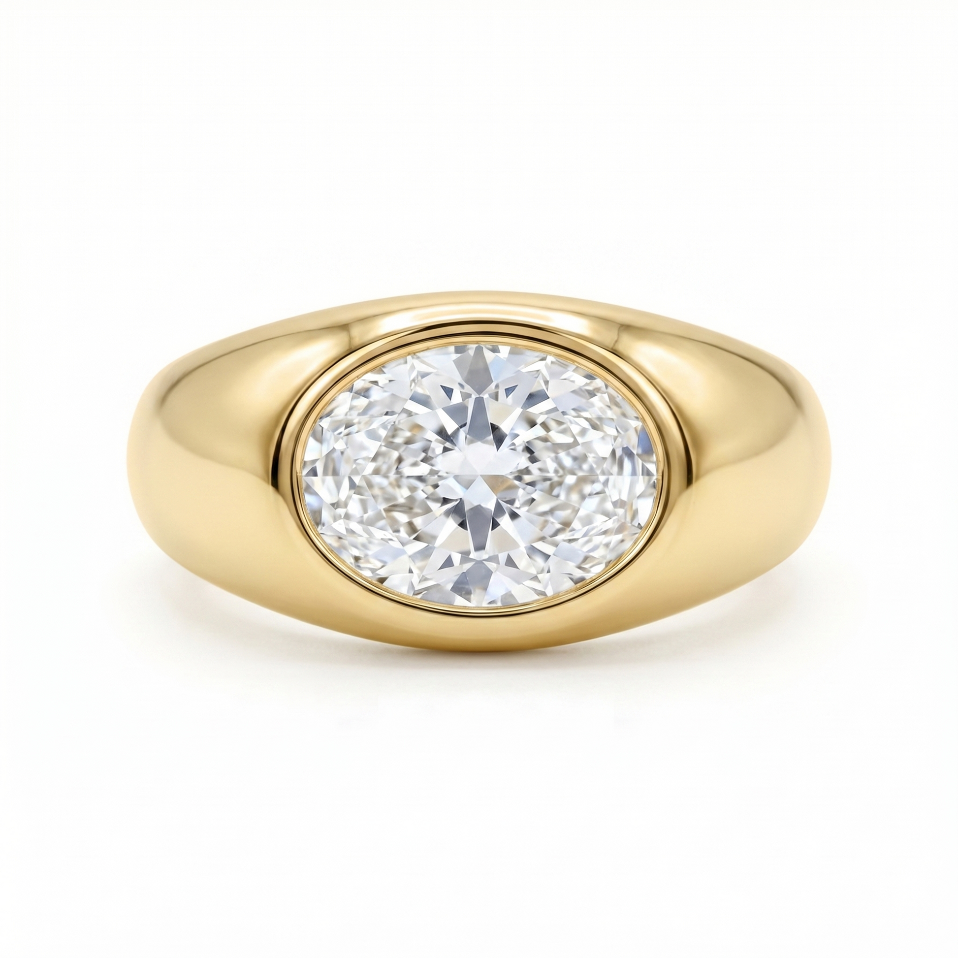 Gold signet ring with a large oval diamond laterally set; cutout product photo on a white background, full frontal view