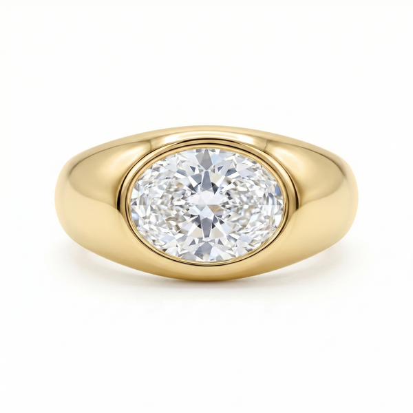 Gold signet ring with a large oval diamond laterally set; cutout product photo on a white background, full frontal view