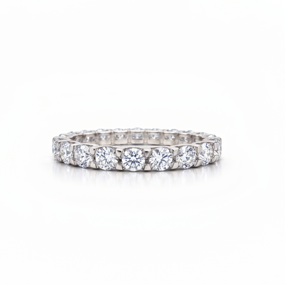 Diamond eternity white gold ring on a white background