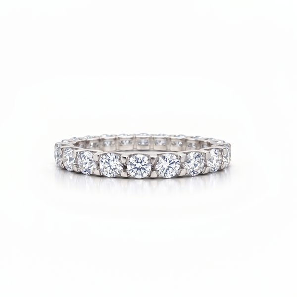 Diamond eternity white gold ring on a white background