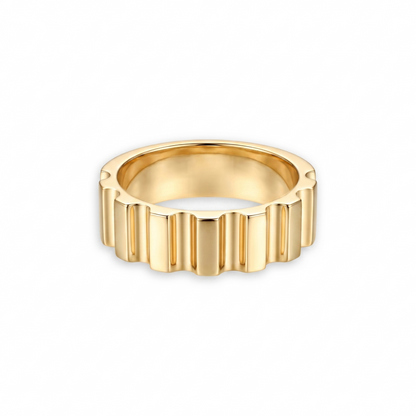 Gold ring with a textured design, gear like appearance on a white background