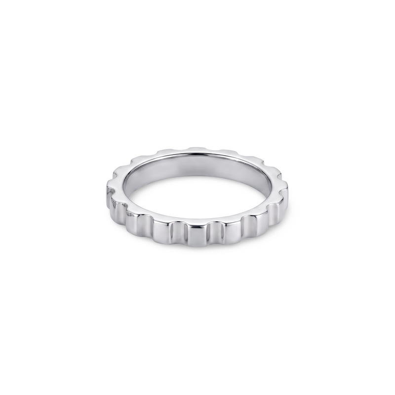 white gold ring with a textured band with ridges looking like a gear; ring is presented on a white background
