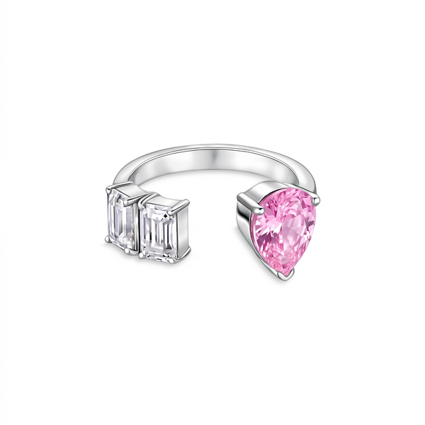 White gold ring with pink pear cut teardrop light pink sapphire and rectangular emerald baguette cut diamond side gemstones on a white background