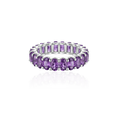 white gold eternity ring with purple amethyst on a white background