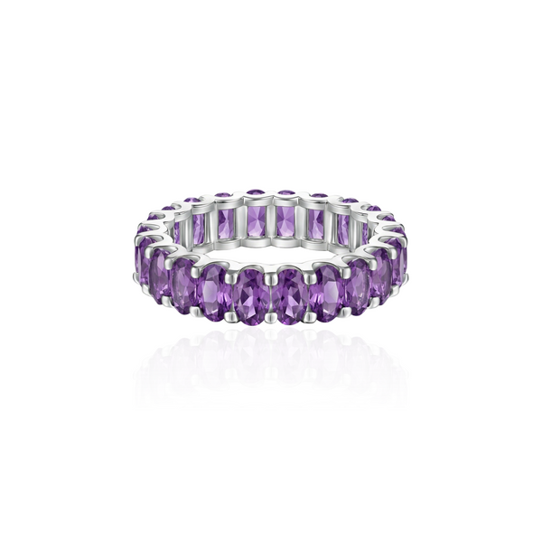 white gold eternity ring with purple amethyst on a white background